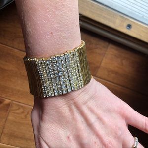 Stretchy gold tone bracelet with cz stones